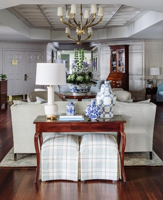 Hotel lobby with white chairs and blue vases in an article about best resorts on the East Coast. 