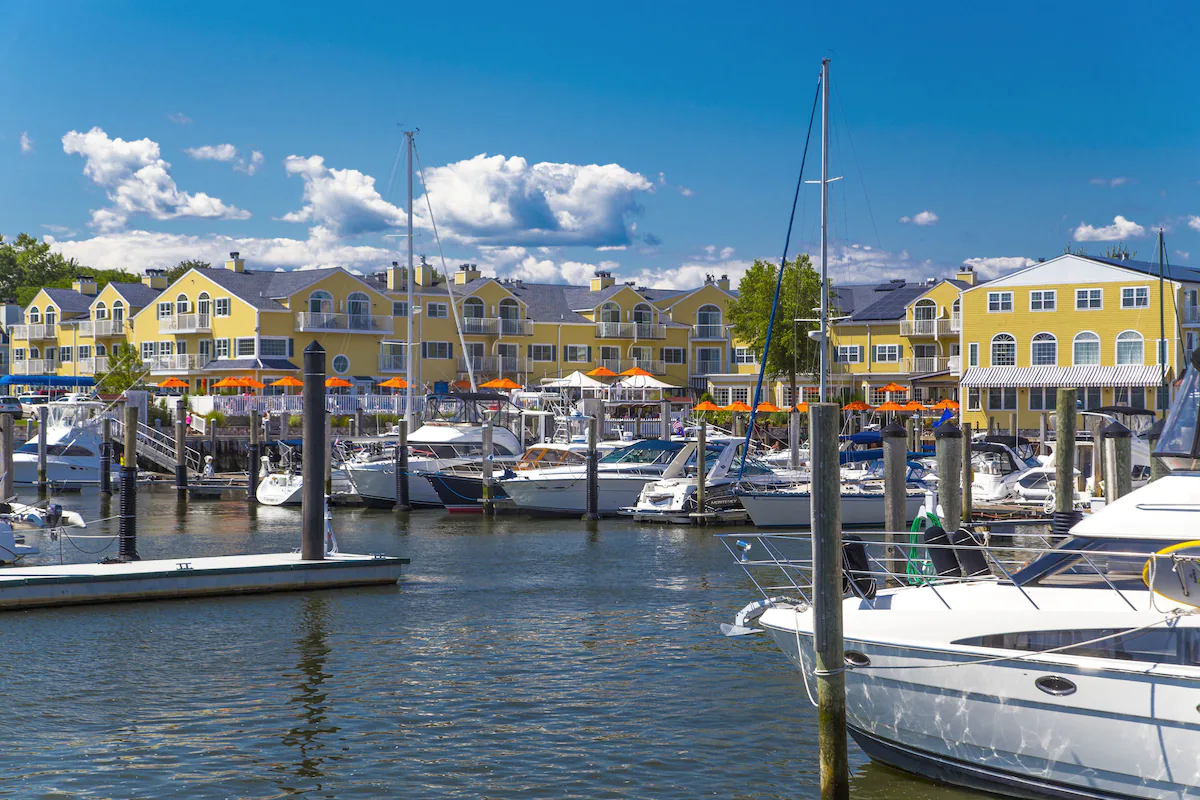 Picture showing a yellow hotel in the harbor in an article about the best resorts on the East Coast