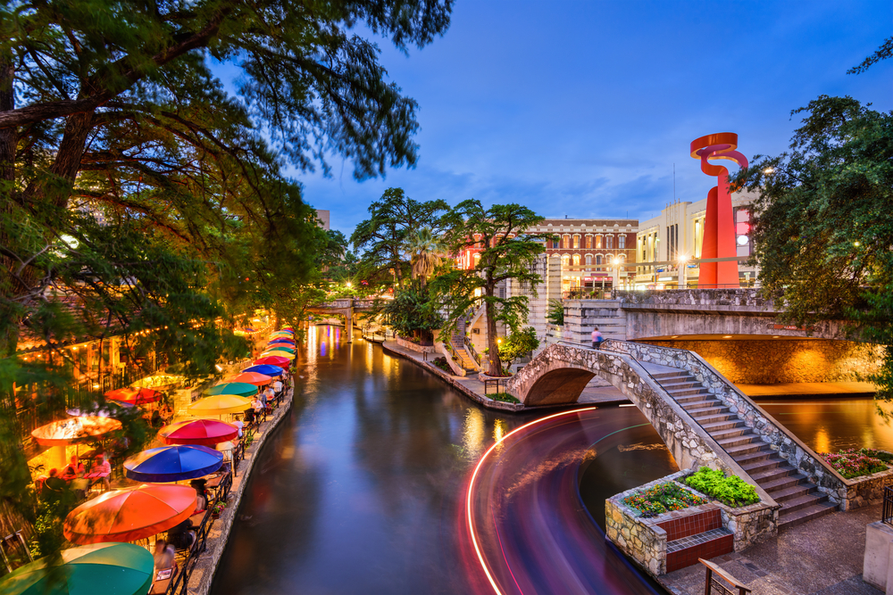 Twilight over the River Walk in San Antonio with colorful umbrellas.