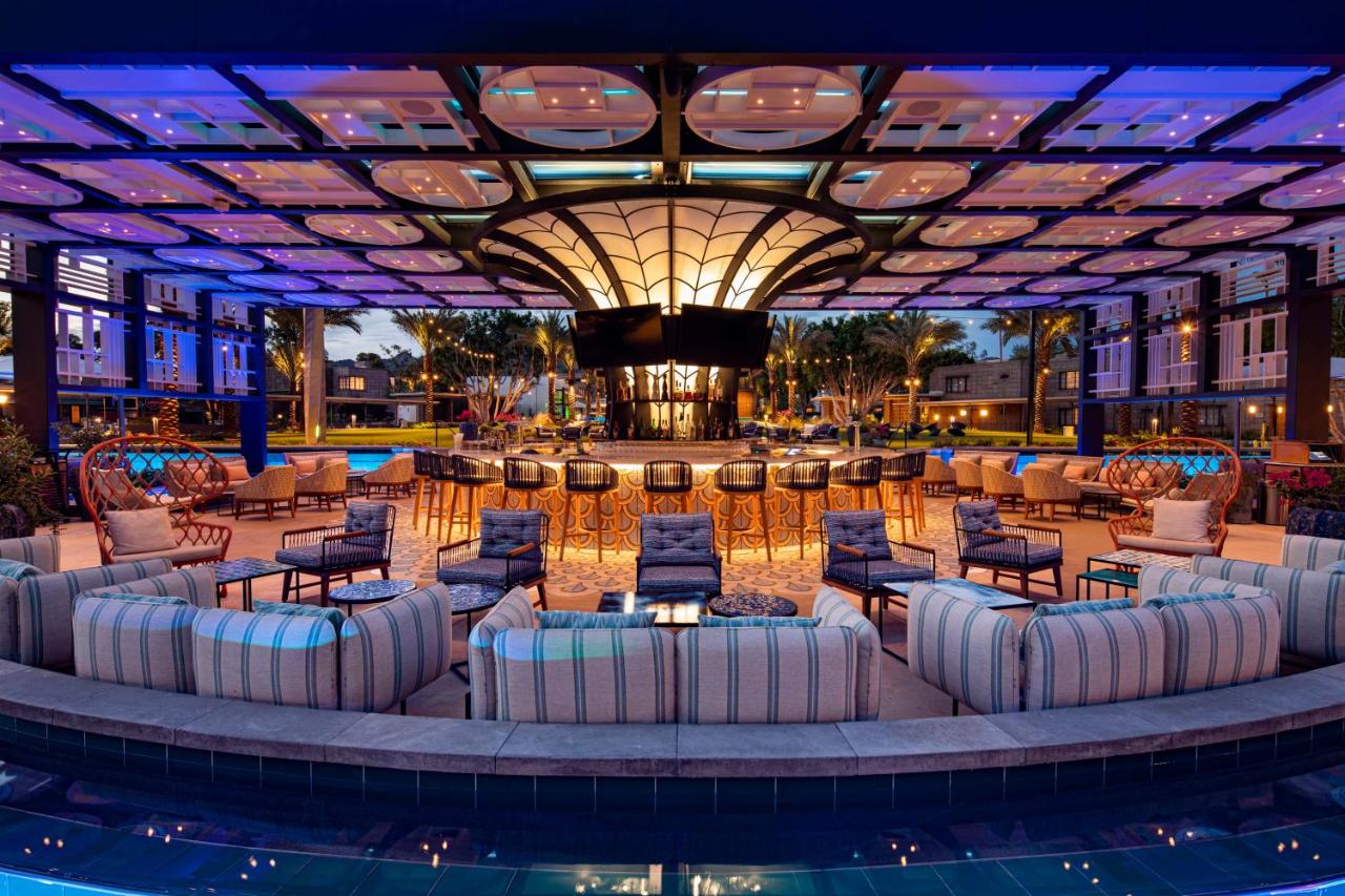 the lounge and bar area in the middle of the pool at the Arizona Biltmore Resort and Spa