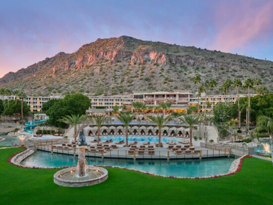 zoomed out view of the pool and resort at The Phoenician with a mountain in the background