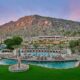 zoomed out view of the pool and resort at The Phoenician with a mountain in the background