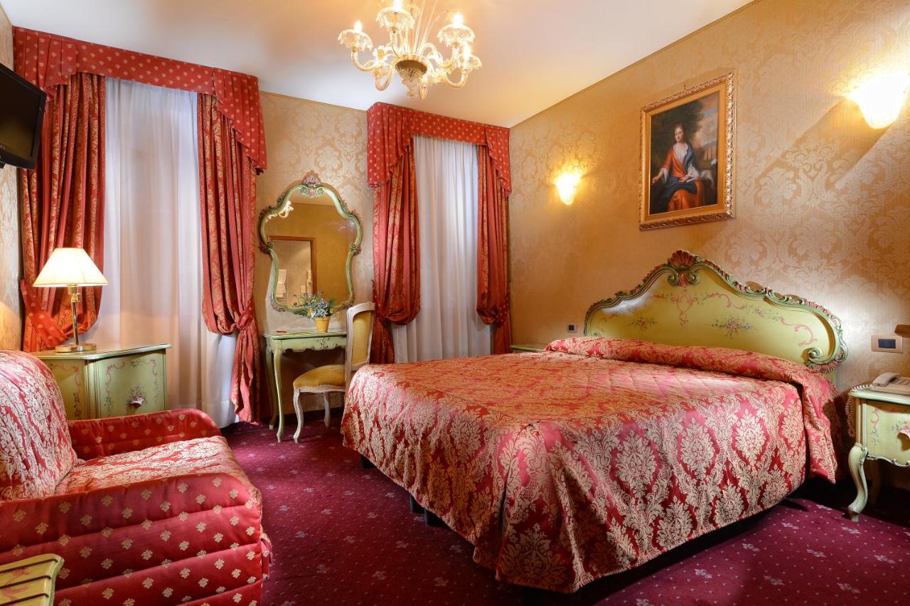 Elegant room at Antico Panada with plush furniture and vanity.