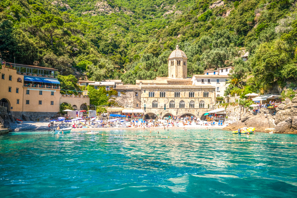 An abbey dominates the small village of San Fruttuoso, where a small crowd enjoys one of the best beaches in Italy. 