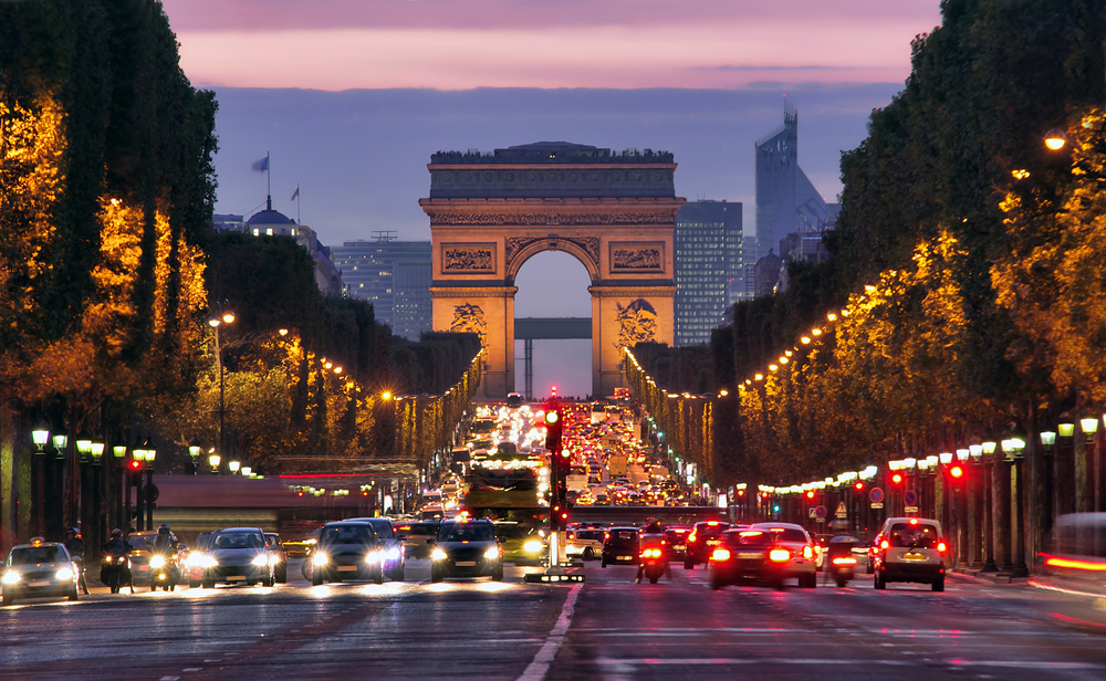 Twilight over the Arc de Tripmphe as seen from the middle of the Champs-Elysees road.