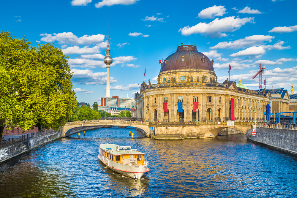 Boat in the river near Museum Island with the TV Tower in the background.
