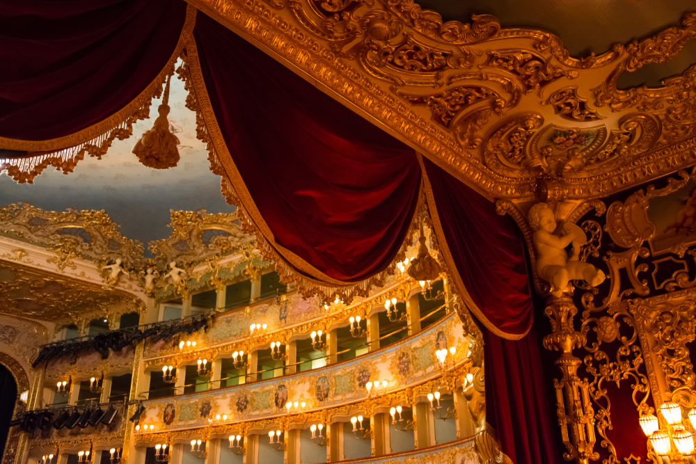 Detail shot of the curtains and ceiling at the Teatro Le Fenice and the balcony seats in the background.