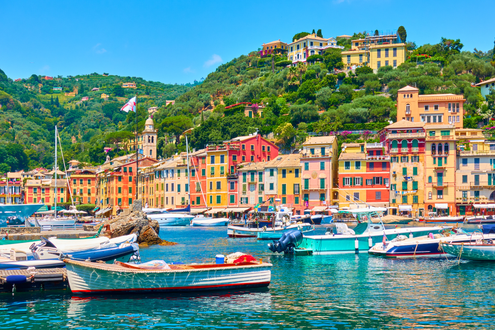 Boats in the harbor with the colorful buildings of Portofino.