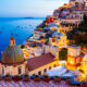 View of Positano at dusk on the coast after planning a trip to Italy