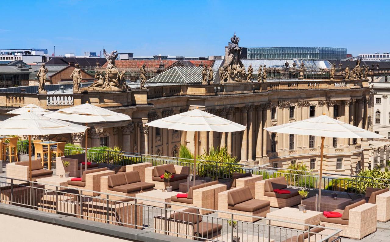 Rooftop lounge with umbrellas overlooking the city.