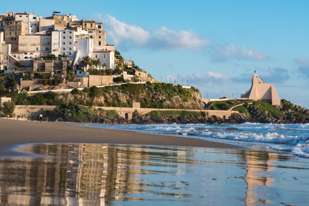 Tide coming in an the sandy beach under the town of Sperlonga, one of the best beach towns in Italy.