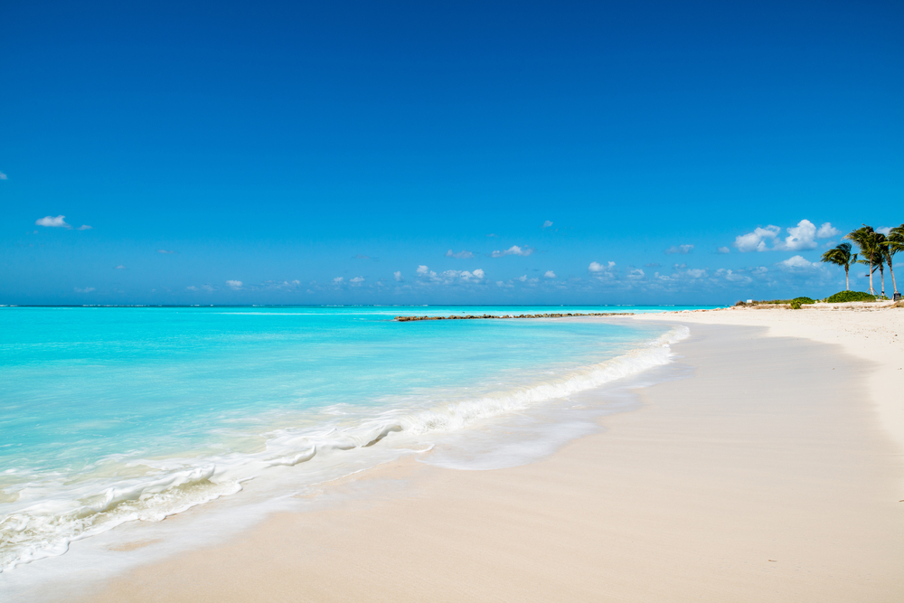 Grace Bay in Turks and Caicos-- as shown in this photo-- is one of the best beaches in the world, known for its soft, white sand, and blue water. There are nearby resorts too! 