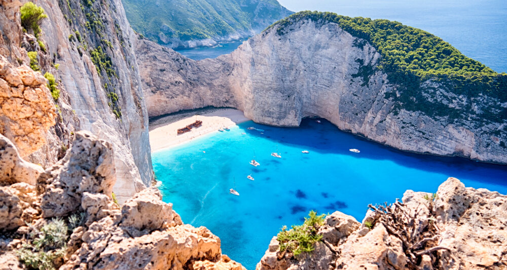 Navagio Beach is one of the best beaches in the world with its cove, nearby walking cliffs, shipwreck and more!