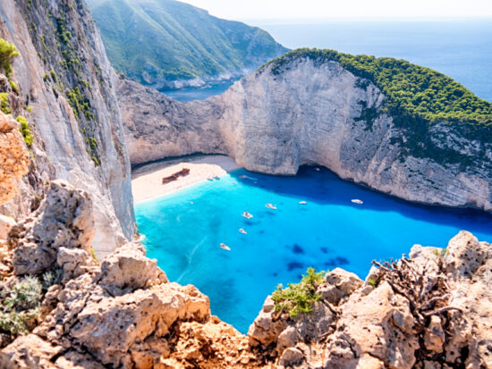 Navagio Beach is one of the best beaches in the world with its cove, nearby walking cliffs, shipwreck and more!