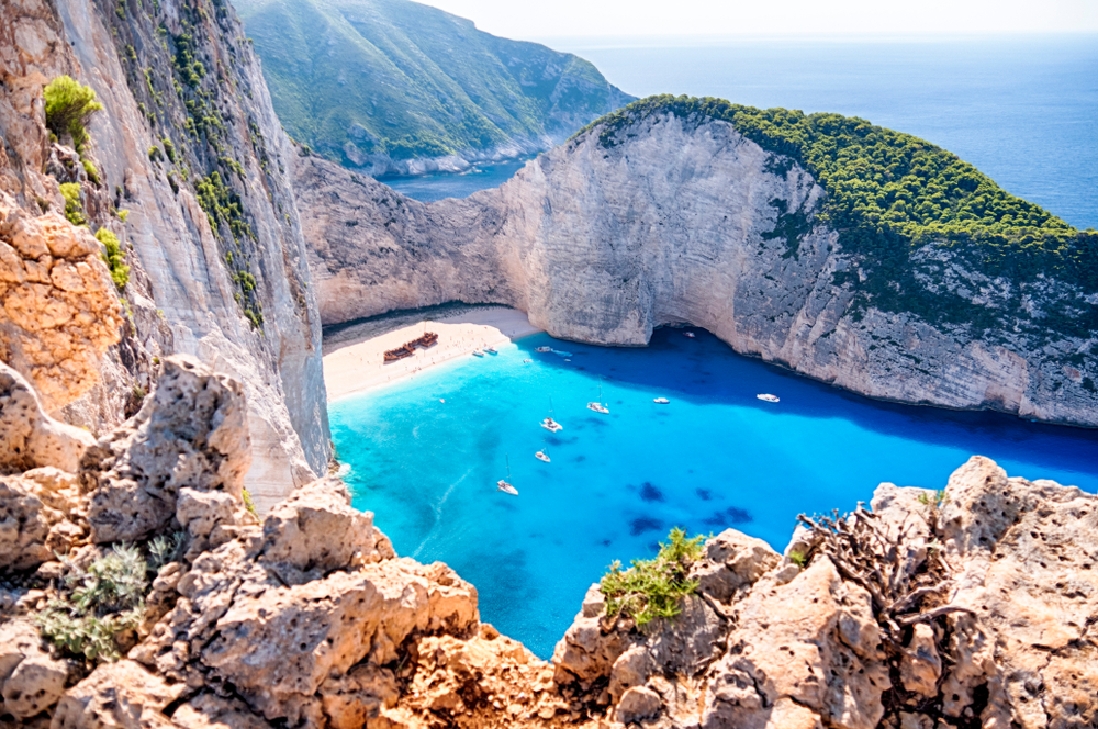 Navagio beach is one of the best beaches in the world with its surrounding cliff walks, shipwrecks, limestone cliffs and cove fashion.