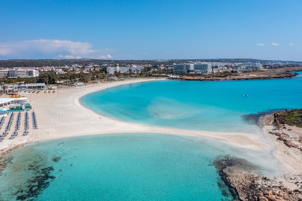 Nissi Beach is one of the best beaches in the world-- as shown in this photo-- because the sandbar and shallow shores makes it perfect for music festivals and parties! 