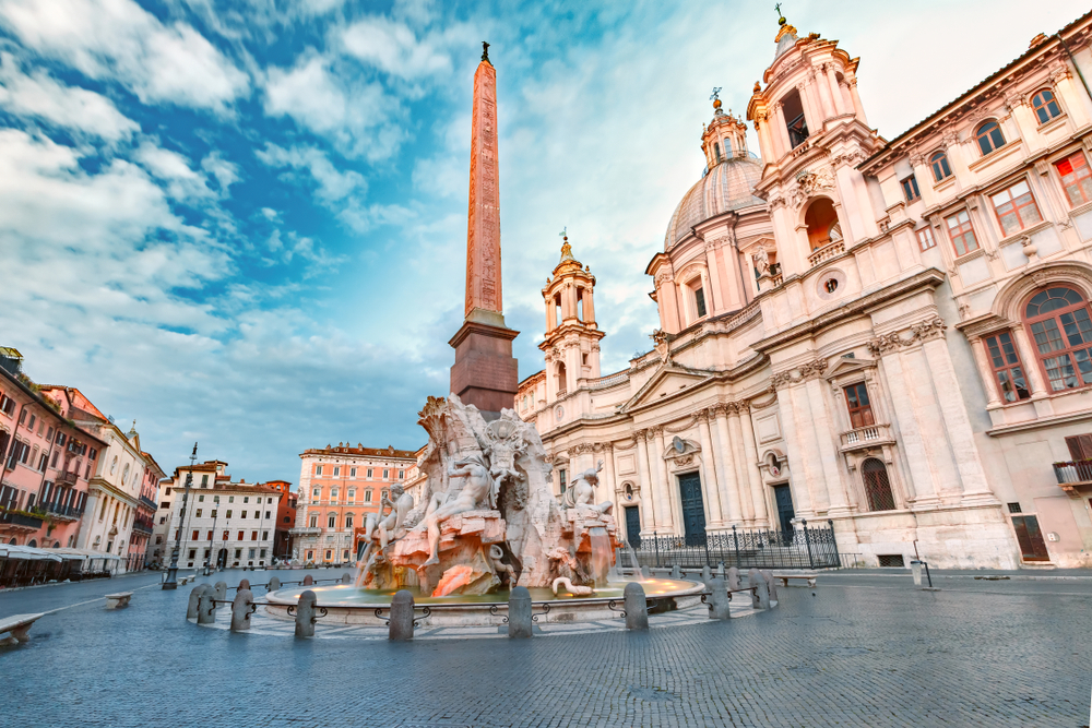 Grand buildings in Piazza Navona with an obelisk fountain in the square during 4 days in Rome.