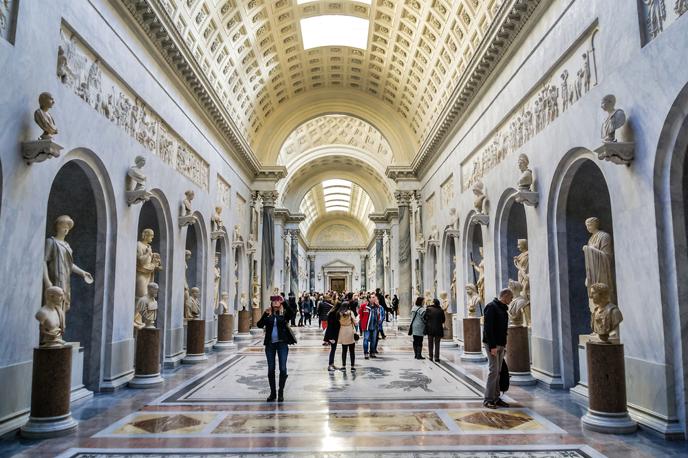 Inside the Pio-Clementine Museum with a hall of statues and busts.