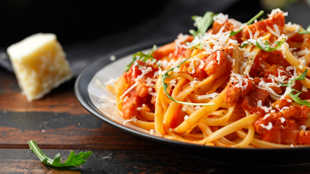 Yummy pasta dish with red sauce and white cheese.