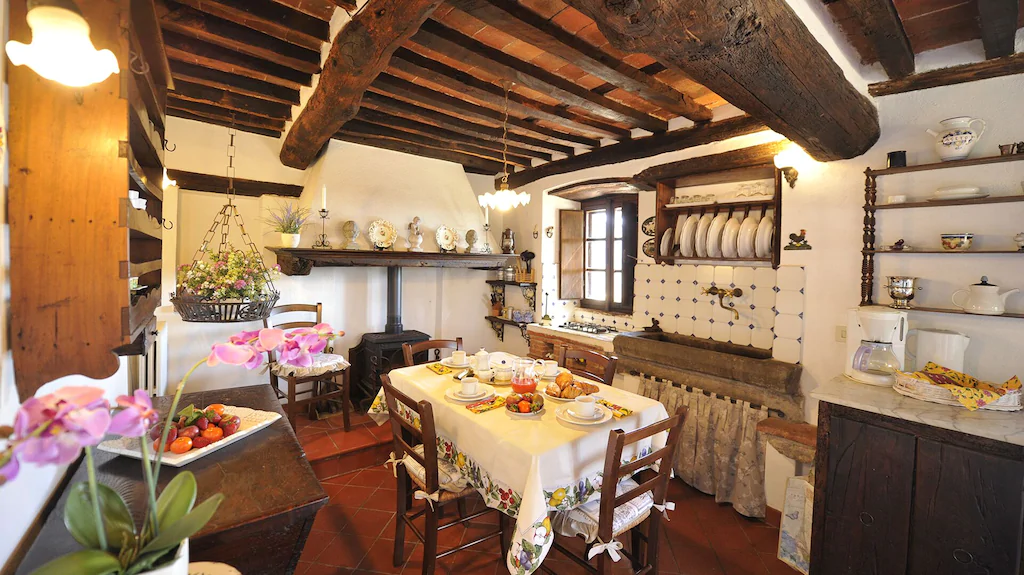The homey and spacious kitchen of this Airbnb in Tuscany