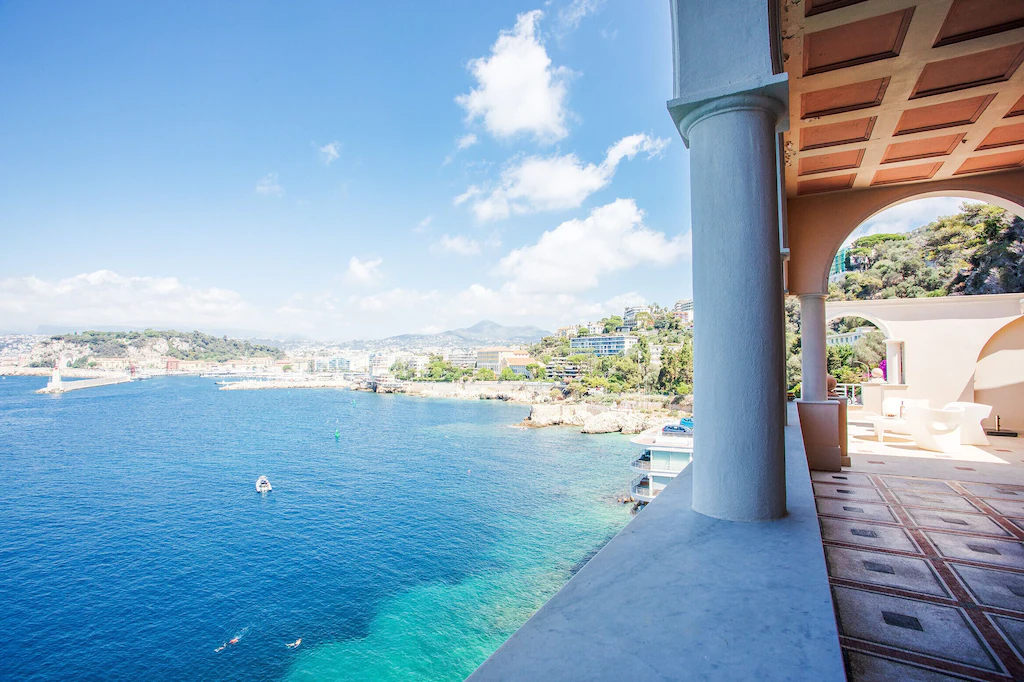 View of the blue sea and the city of Nice from the Cap de Nice VRBO. This is one of the luxury airbnbs in France. 