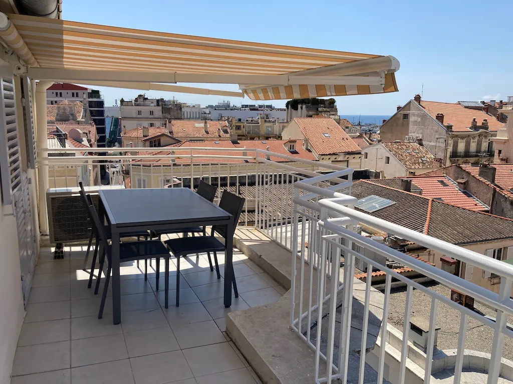 View from the penthouse balcony over the rooftops of Cannes to the sea beyond. This is one of the best France airbnbs. 