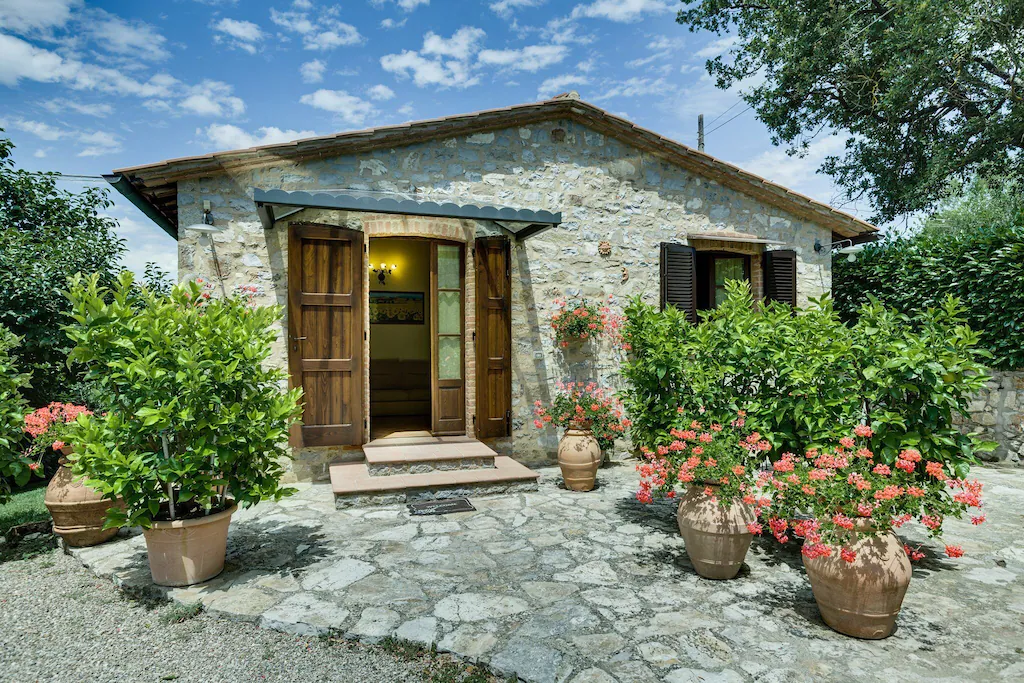 Classic limestone exterior of the Tuscan Farmhouse Airbnb. 