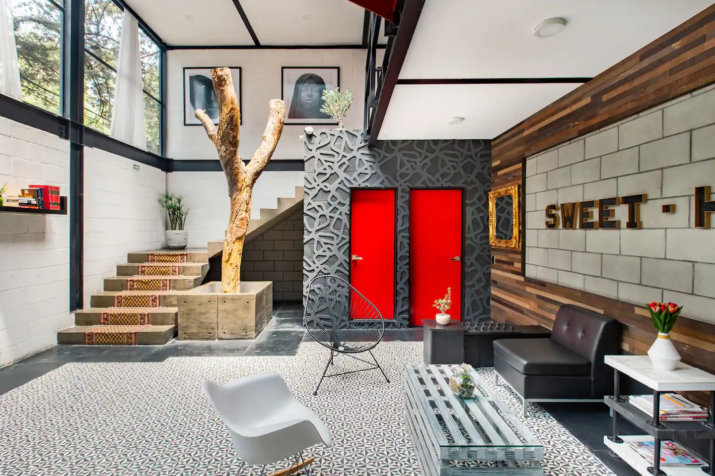 View of the double height ceilings and bright colors of the colorful industrial loft in Mexico city. This is one of the best airbnbs in Mexico.