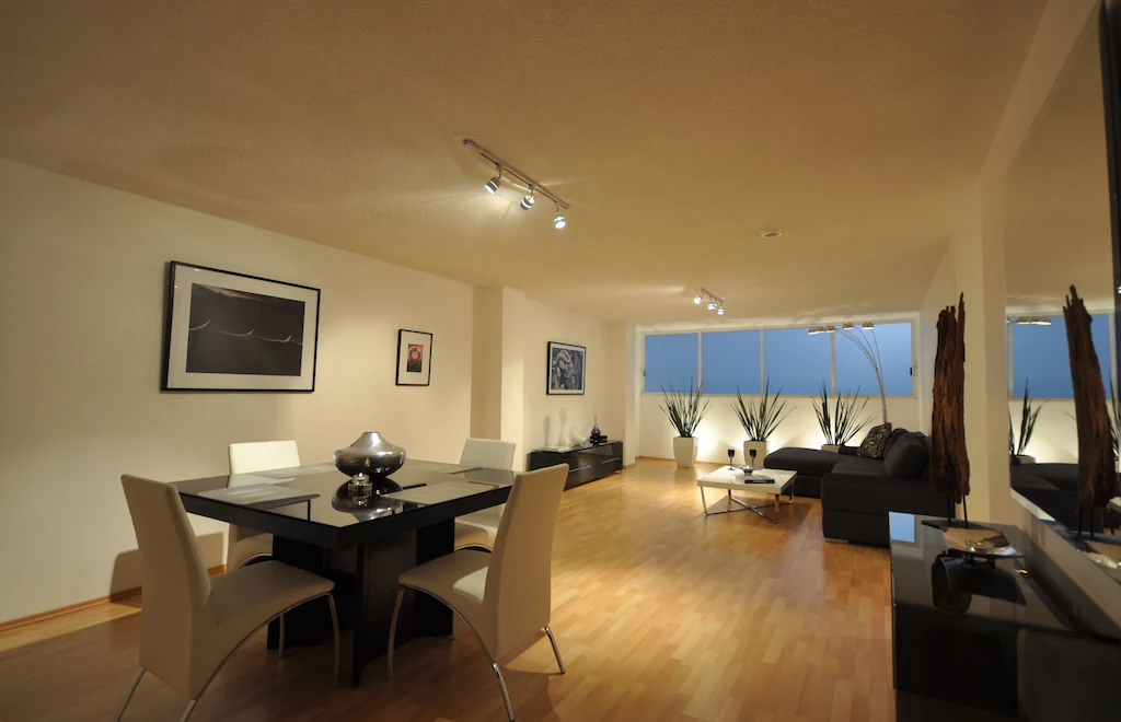 View of the spacious, sleek, modern living room of the two bedroom near Reforma. 