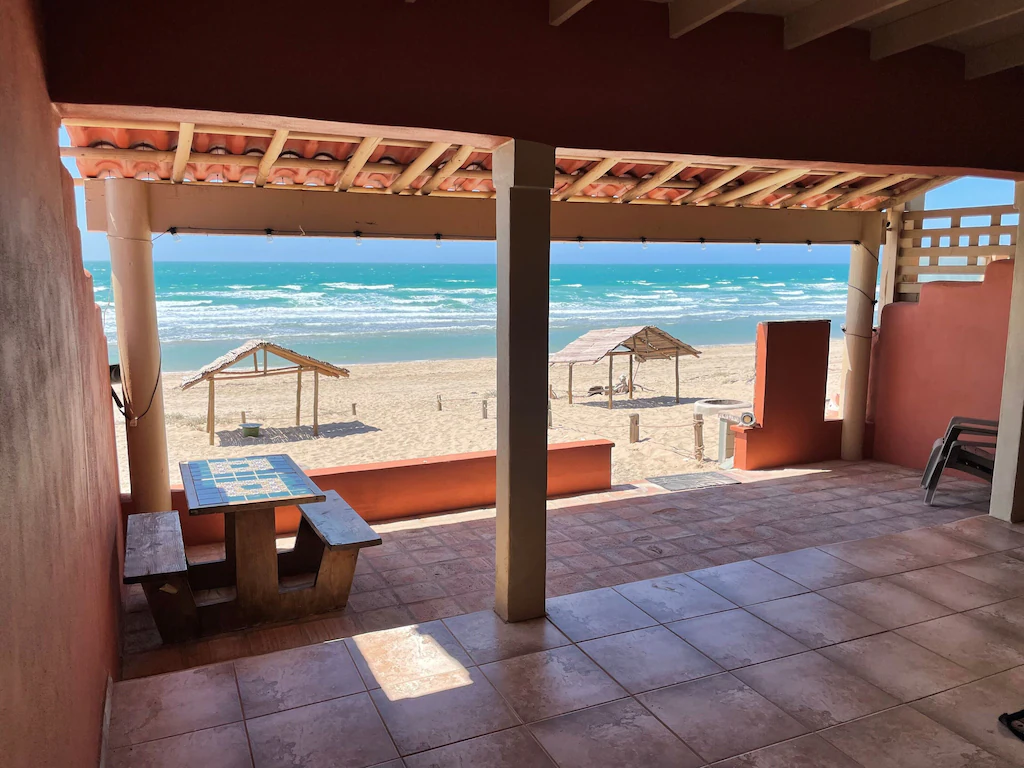 View of the terracotta porch and ocean view beyond from casita calypso