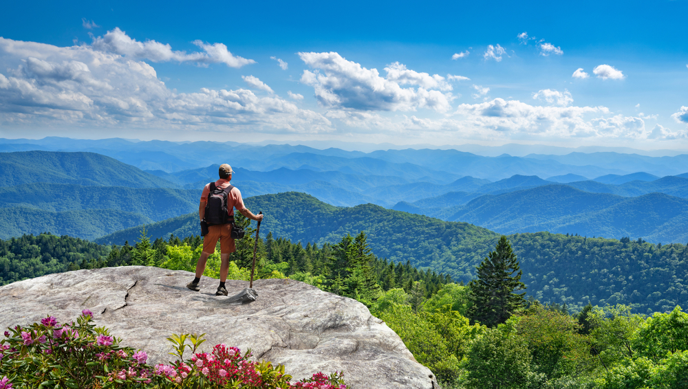 Asheville Nc blue ridge Mountains with a man over looking them 