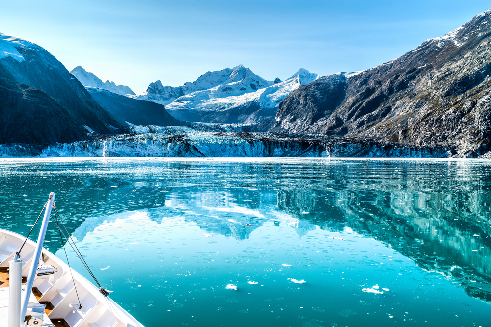 Alaska in the summer time with snowcapped mountains a beautiful clear lake 