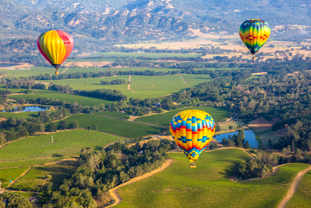 hot air balloons over Napa valley. Visiting here is one of the best summer vacations in the USA 