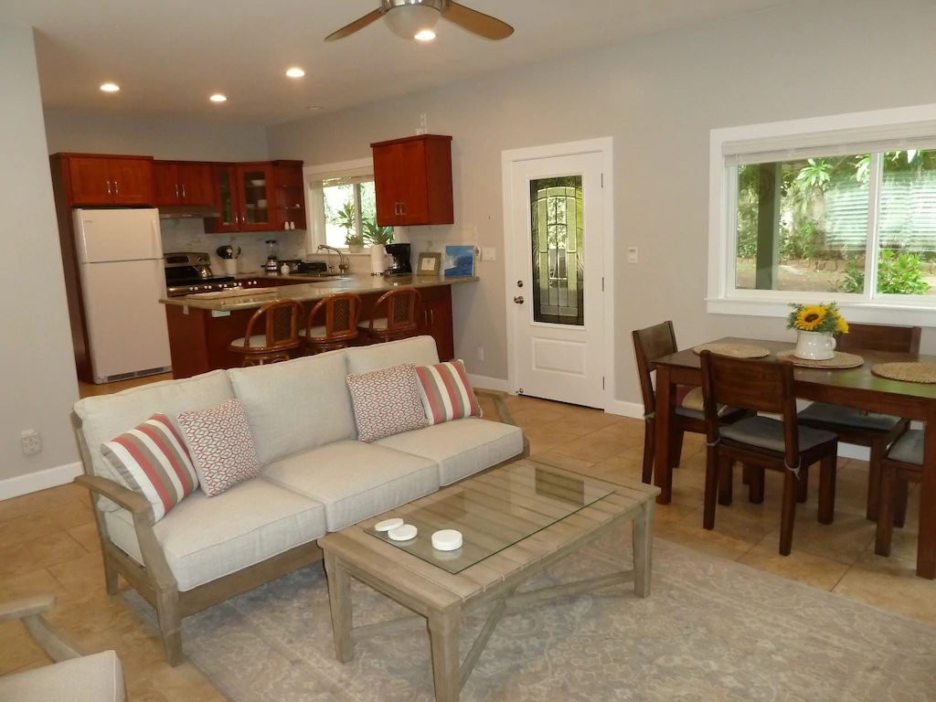 View of the simple kitchen and living room of one of the best VRBOs in Oahu