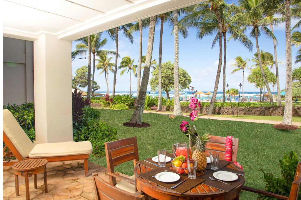View of the ocean and palm trees from the lanai of the Turtle Bay Beachfront 