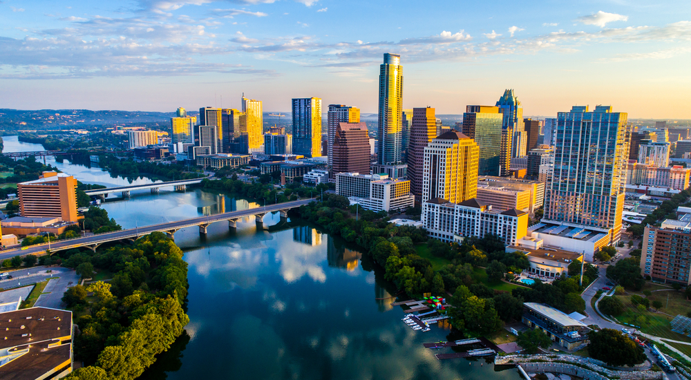 the big city of Austin texas in the winter time. with a big lake running through the middle of town 