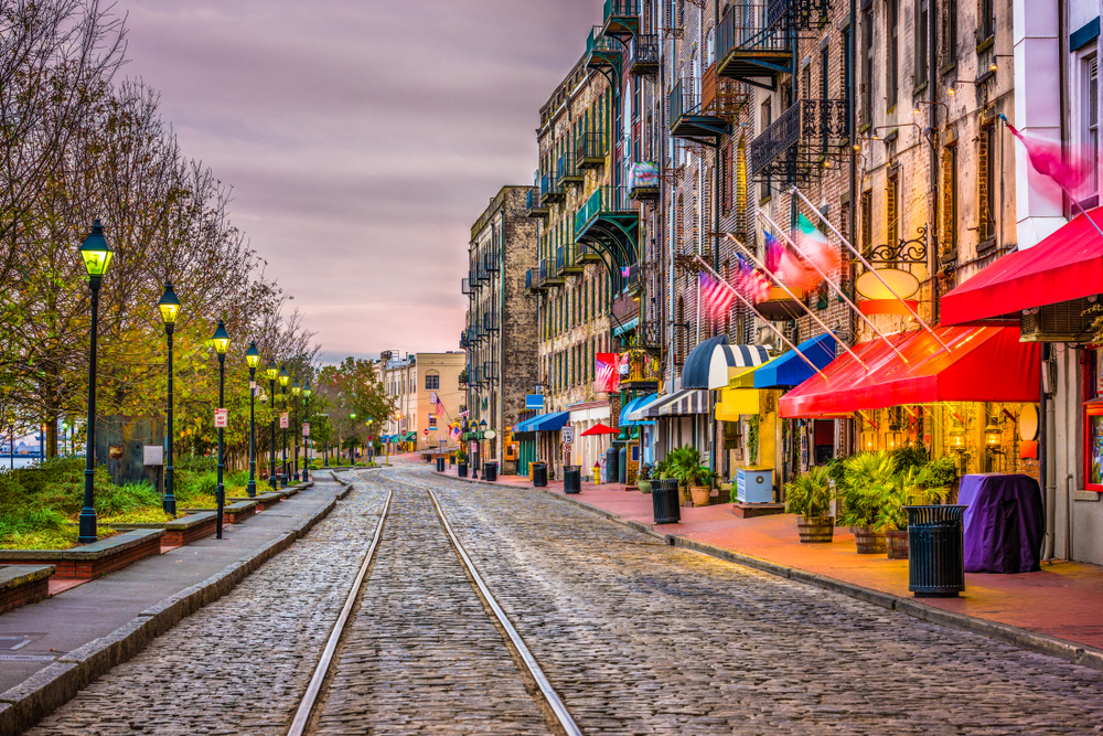Savannah is one of the best winter vacations in the USA here is a colorful street with the train tracks running through it