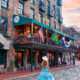 a girl in a blue dress standing in front of the riveer in Savannah GA