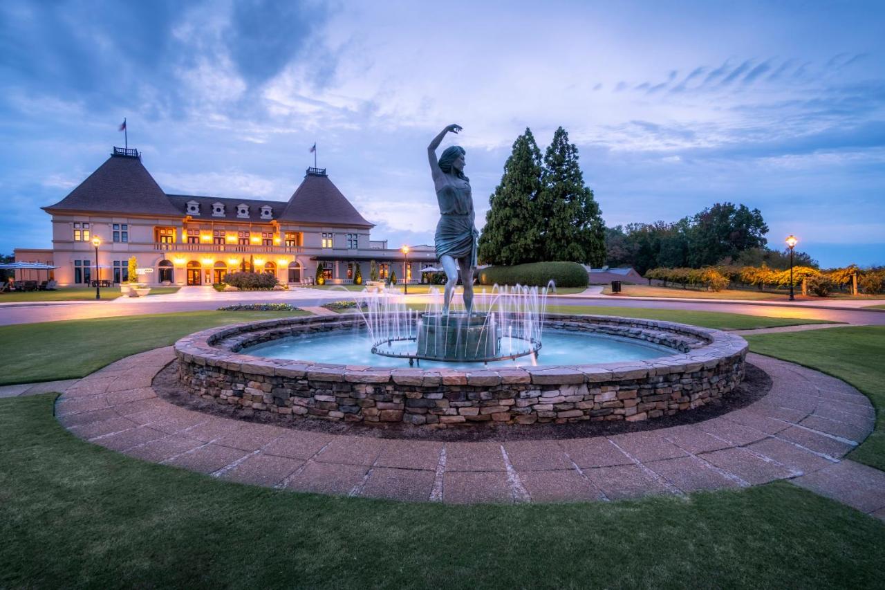 The Chateau Elan hotel and winery with water fountain with statue and hotel in background