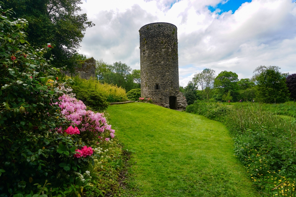 The Keepers Watch Tower and flower garden at Blarney Castle, a medieval stronghold built in 1446.