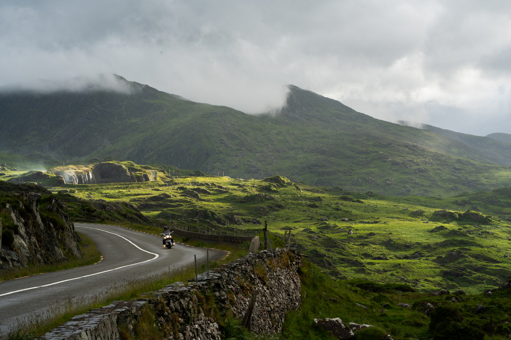 Riding Motorcycle in Ireland with a mountain scenery 