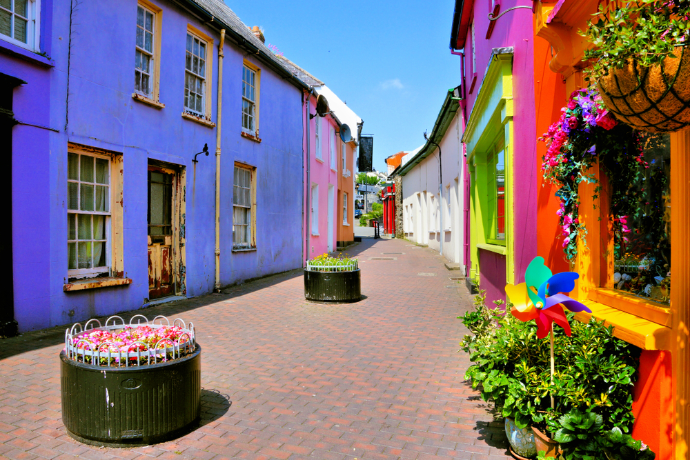 Quaint street lined with vibrant colorful buildings in the Old Town of Kinsale, County Cork, Ireland