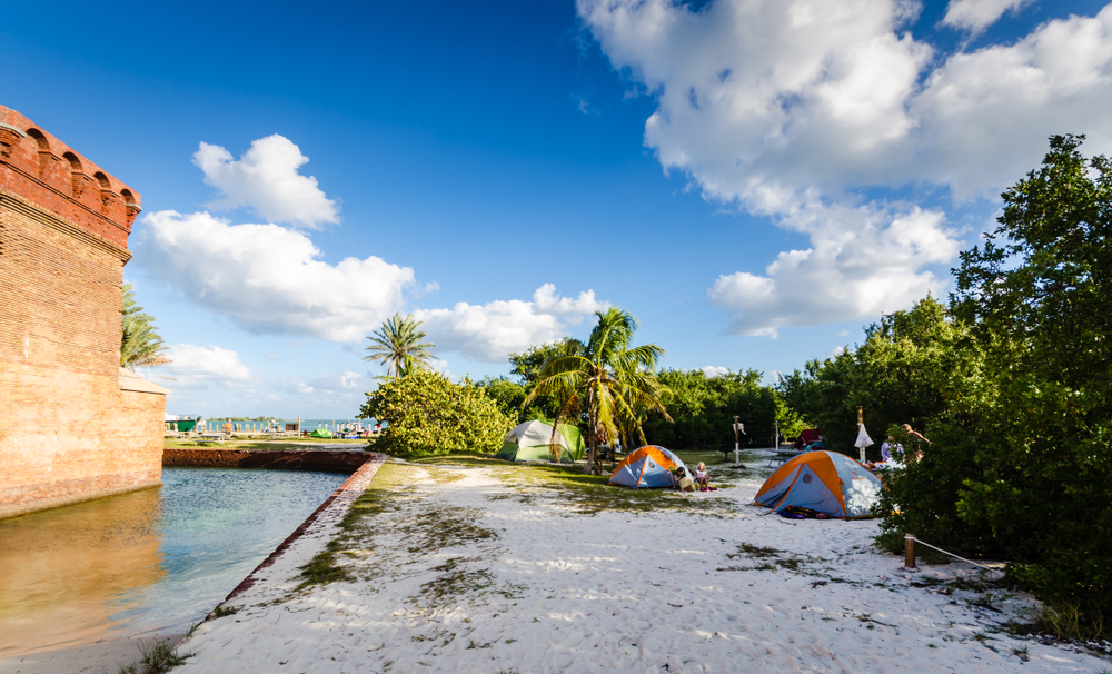 Two tents pitch at the cusp of the fort in Dry Tortugas, which is one of the spots for best beach camping in the USA.