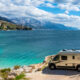 photo of an RV with mountains int he background at one of the best beach campgrounds in the USA