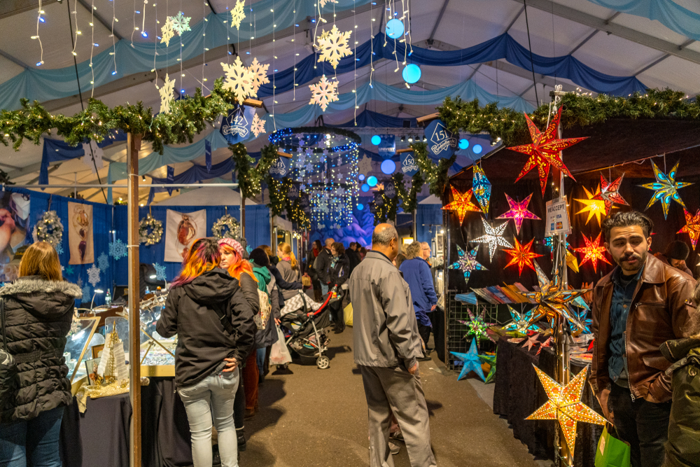 a Christmas market in Bethlehem PA full of lights and displays and vendors selling crafts. visiting here is one of the best Christmas towns in the usa 