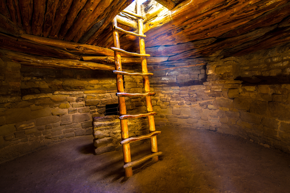 A ladder coming down from the ceiling on a Mesa Verde hike.