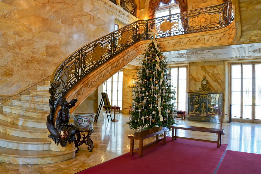 an indoor holiday display in Newport Rhode Island full of decorations and a big christmas tree. this is one of the best Christmas towns in the usa 