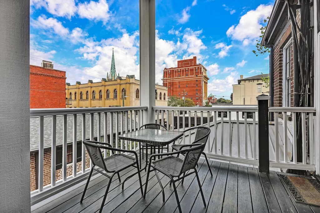 View of the private balcony overlooking downtown Savannah from the Historic Jones Street Home