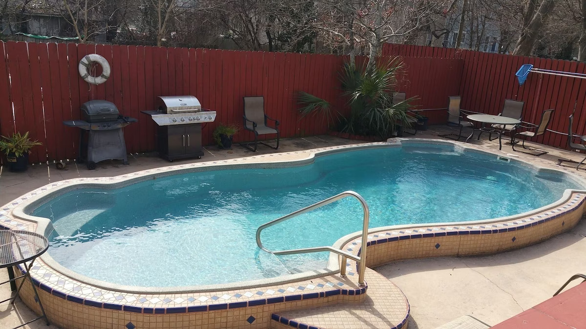 View of the backyard pool of the midtown condo with ool. 