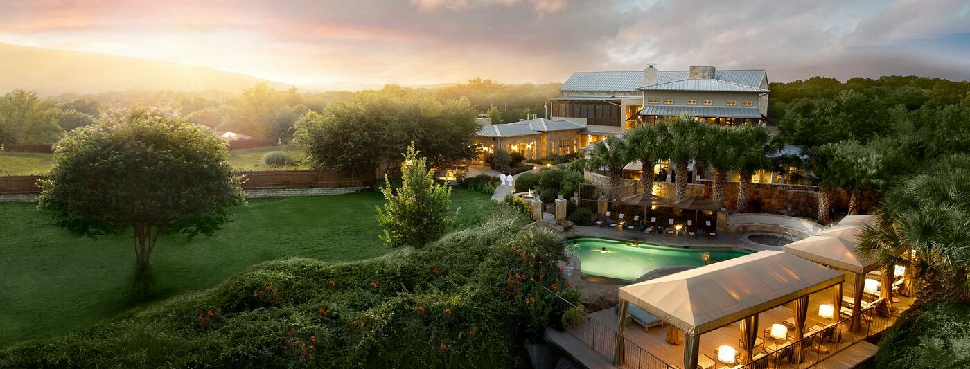 swimming pool at sunset outside of lake austin all inclusive in texas